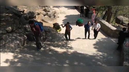 泰山挑山工视频,坚韧与智慧的壮丽画卷